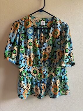 CAbi Floral Peplum Happy Top V-Neck Blouse in Blue, Green, Orange, Cream, Black